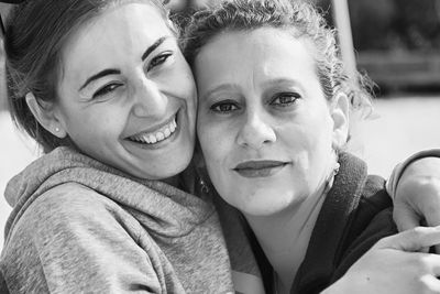 Portrait of mother and daughter outdoors