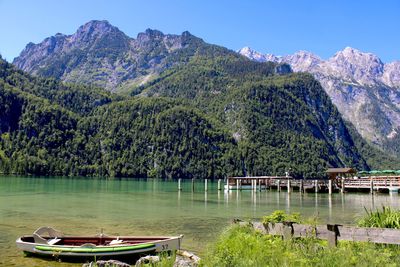 Scenic view of lake and mountains against sky