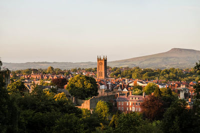 Distant view of st laurence church in town against clear sky