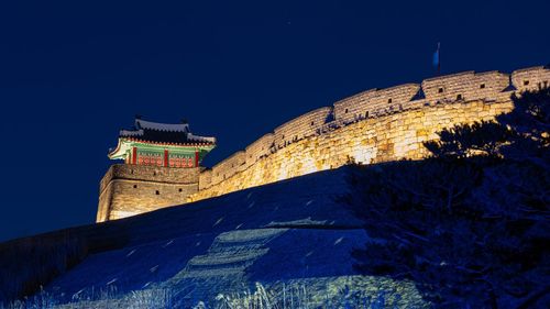 Low angle view of building against sky at night