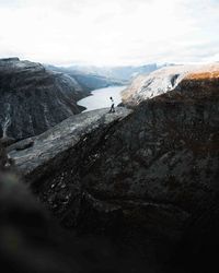 Distant view of person walking on mountain