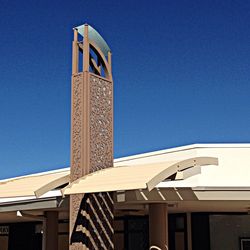 Low angle view of built structure against clear blue sky