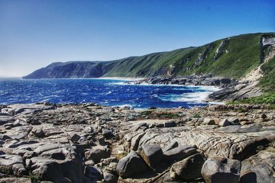 Scenic view of sea against blue sky