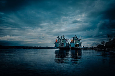 Ship sailing in sea against sky