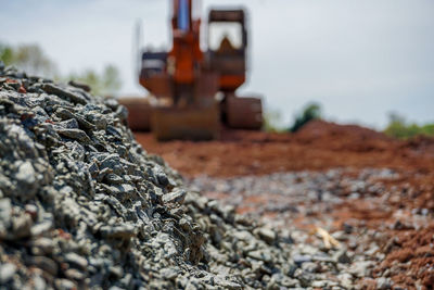 Close-up of machine part on rock