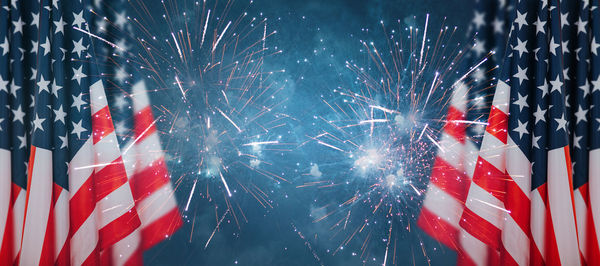 Low angle view of firework display at night