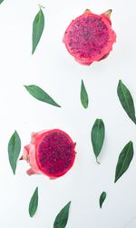 Close-up of strawberries on table against white background