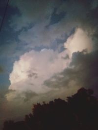 Low angle view of silhouette trees against sky at sunset