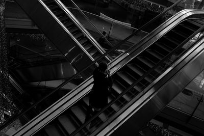 High angle view of woman on escalator