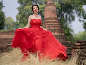 Portrait of a young woman standing outdoors