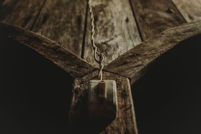 Close-up of doorbell on wood