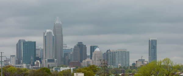 Modern buildings against sky in city