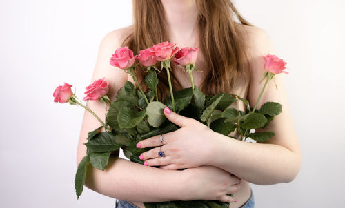 Midsection of woman holding plant