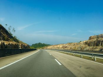 Empty road against sky