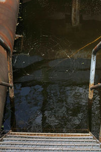 High angle view of metallic structure in lake