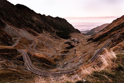Scenic view of mountain road against sky