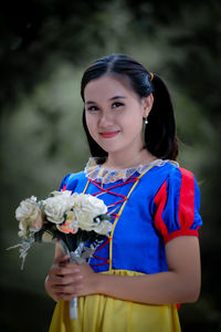 Young woman holding bouquet