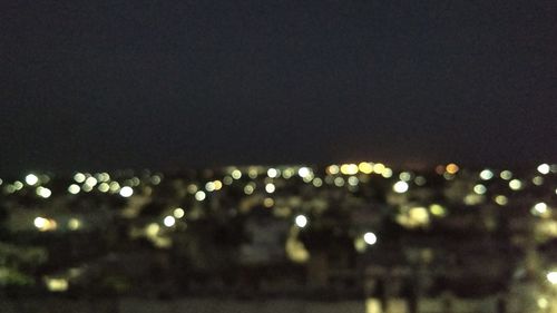 Defocused image of illuminated lights at night