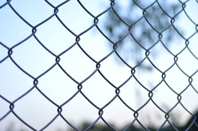 Full frame shot of chainlink fence against sky