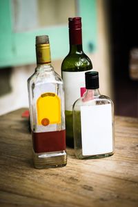 Close-up of wine bottles on table