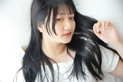 Close-up of young woman looking away