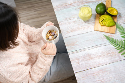 Healthy eat and lifestyle with top view woman eat breakfast with avocado slice and smoothie 