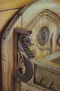 Low angle view of carvings on ceiling of building