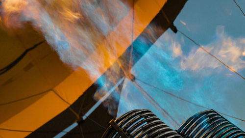 Low section view of multi colored light against sky