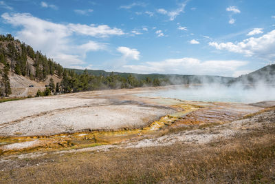 Scenic view of smoke emitting from midway geyser basin at yellowstone park