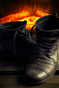 Close-up of shoes on wooden floor