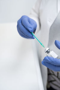 Close-up of scientist holding dental equipment