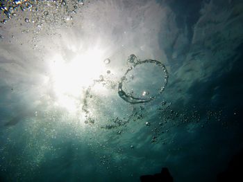 Low angle view of bubbles in water