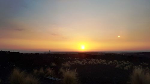 Scenic view of silhouette landscape against sky during sunset