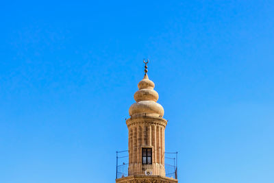 Low angle view of building against blue sky