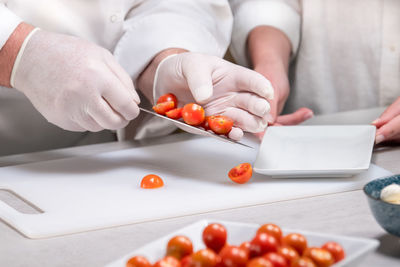 Midsection of man preparing food