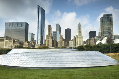 Modern buildings in city against sky