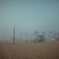 Scenic view of beach against clear sky