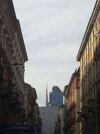 Buildings in city against sky