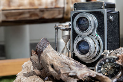 Close-up of old camera on table