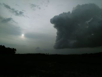 Silhouette landscape against sky