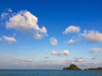 Scenic view of sea against blue sky