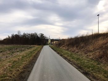 Road amidst landscape against sky