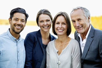 Portrait of happy business people outdoors