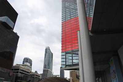 Low angle view of modern buildings in city against sky