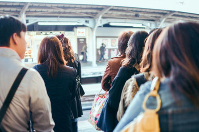 Rear view of people in train