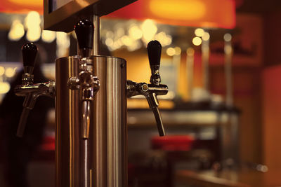 Close-up of wine glasses on bar counter