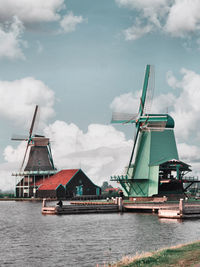 Traditional windmill against sky