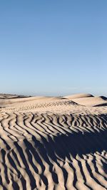 Scenic view of desert against clear sky