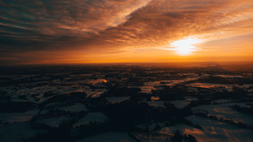 Aerial view of city during sunset