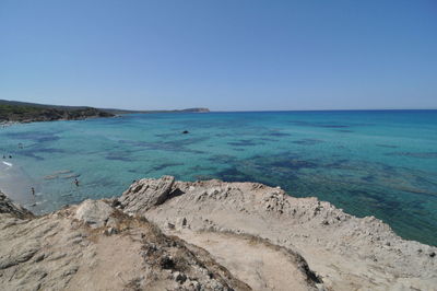 Scenic view of sea against clear blue sky